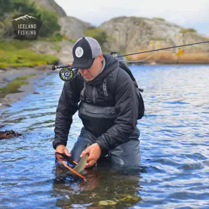 Angler wearing durable chest stockingfoot zip waders in a river.